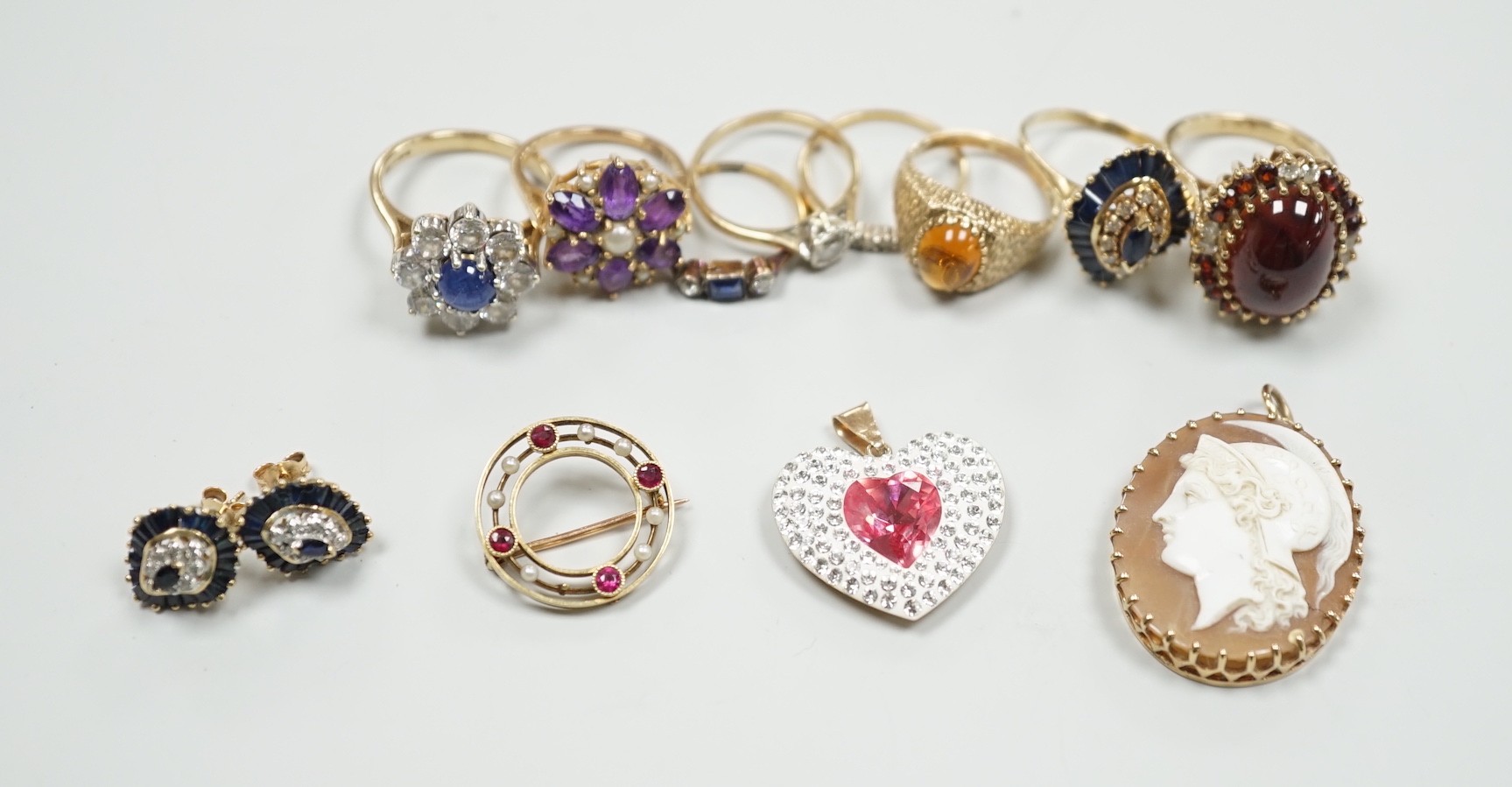 Eight assorted mainly modern 9ct gold and gem set dress rings, including amethyst and split pearl cluster, gross weight 30.7 grams, a 15ct, ruby and seed pearl set open work circular brooch, gross 2.6 grams, pair of 9ct,
